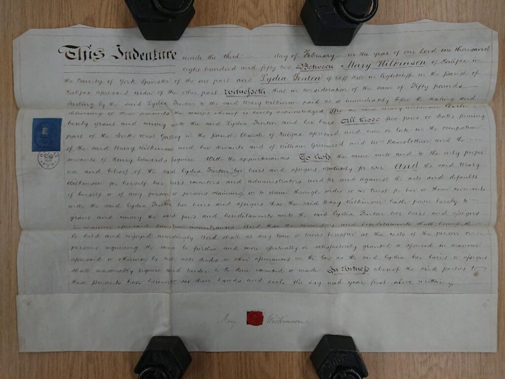 Image shows document detailing conveyance of five pews